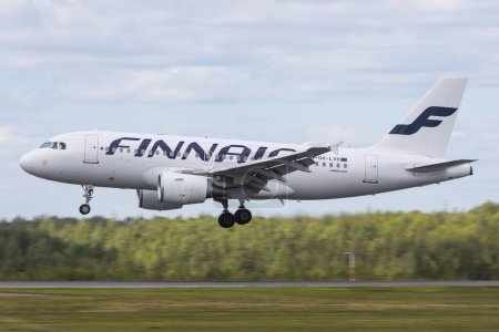 Photo for Helsinki, Finland - June 5, 2023: Finnair landing after a flight with Airbus A319 - Royalty Free Image