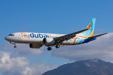 Photo for Salzburg, Austria - January 27, 2024: FlyDubai approaching with a Boeing 737-8max in Salzburg, Austria after a flight from Dubai - Royalty Free Image