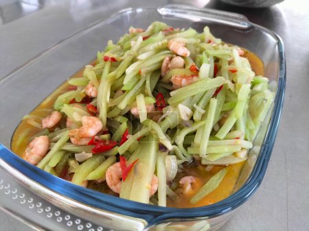 Selective focus. Stir-fried chayote is a dish consisting of chayote, shrimp and eggs, cooked by sauteing. Served on a plate. Indonesian food.