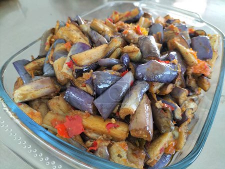 Terong Balado or balado eggplant is a Indonesian traditional food from Minangkabau, West Sumatra. Purple eggplant cut into pieces then fried and mixed with sambal or cabe giling
