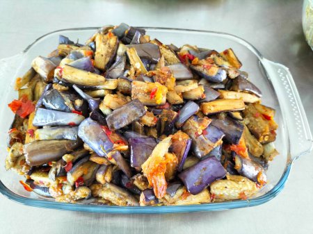 Terong Balado or balado eggplant is a Indonesian traditional food from Minangkabau, West Sumatra. Purple eggplant cut into pieces then fried and mixed with sambal or cabe giling