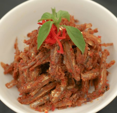 Sambal balado teri is fried anchovy with hot and spicy chili sauce.Traditional Indonesian food. Close-up.
