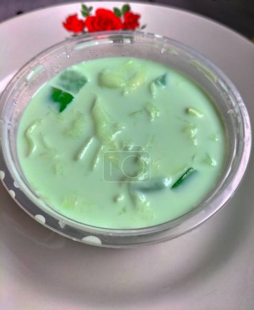 Selective focus. Buko Pandan is a dessert originated from the Philippines. Made of jelly, young coconut and whip cream. Best served cold.