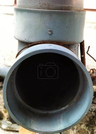 Closeup view of dirty water pipes from the kitchen. Indonesia.