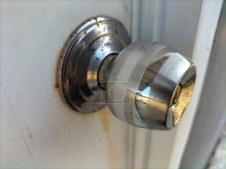 Closeup view of stainless door knob background.
