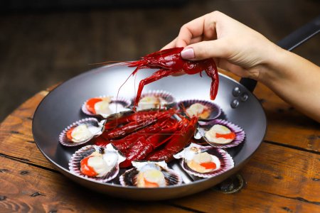 Photo for Spanish seafood set- red fresh shrimps Camarones Rojo and fresh raw scallops Zamburinas - Royalty Free Image