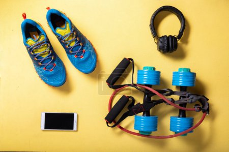 Cardio workout. Running sneakers and jump rope. Jump rope and dumbbells. Cardio with music.