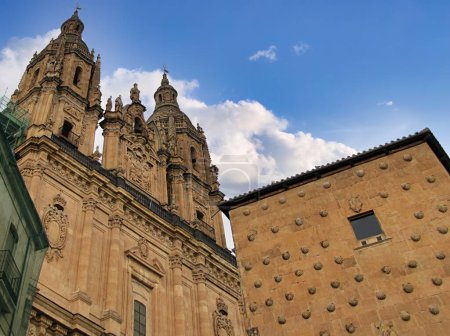 Salamanca, Spain  Casa de las Conchas and La Clereca church buildings in Salamanca, Spain, low angle view.