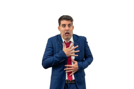 Photo for Businessman clutches his chest with his hands, displaying fear and surprise. With a sudden sense of panic and alarm, he embodies corporate fright and terror white background - Royalty Free Image