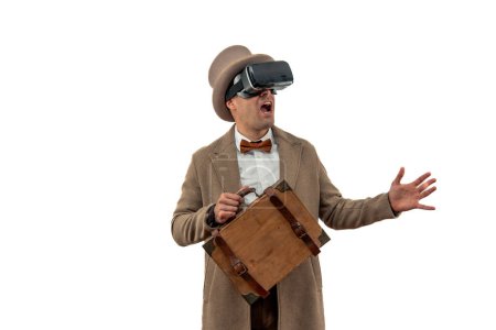 early 20th century with a vintage man wearing a bowler hat and trench coat, caught in awe as he experiences virtual reality through retro VR glasses white background