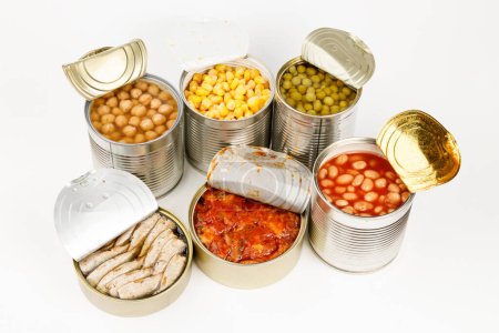 Foto de Seafood and vegetables in cans, food donations. - Imagen libre de derechos