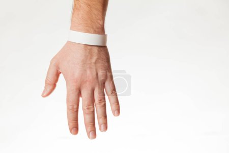 Photo for Hand with white wristband mockup. Empty ticket wrist band design. - Royalty Free Image