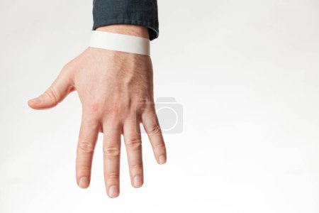 Photo for Empty white paper wristband, hospital (resort) bracelet. Empty (copy space) design. - Royalty Free Image