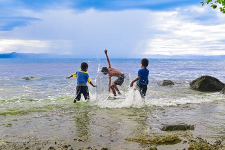Photo for Children playing on the beach - Royalty Free Image