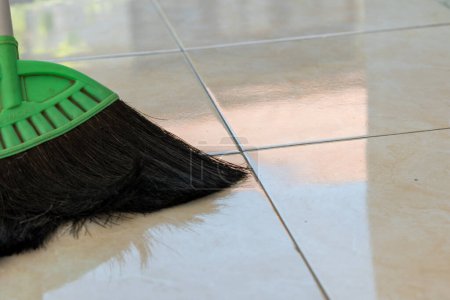 Sweep palm fiber on the ceramic floor