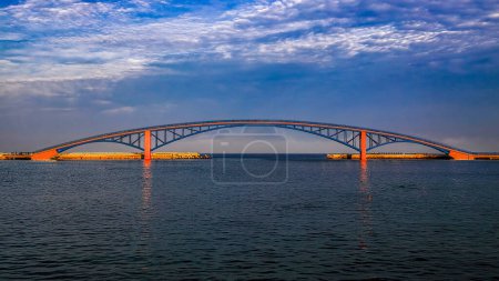 Photo for Amazing cirrus cloud view and beautiful arch iron bridge in the early morning form a scenic sea scene. Magong City Penghu CountyTaiwan For branding,calender,postcard,screensave,wallpaper,poster,banner,cover,website.High quality photo - Royalty Free Image