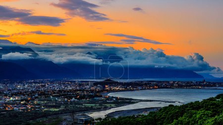 Beautiful vast color cloudscape,sea and bay city night view after scenic sunset, Hualien,Taiwan.For branding,calender,postcard,screensave,wallpaper,poster,banner,cover,website.High quality photography