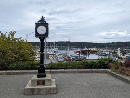 Photo for Historic Clock in the harbour of Port McNeil - Royalty Free Image