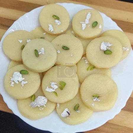 Photo for Malai peda or white pera is a North Indian sweet Mithai or delight,prepared with full cream milk,sugar and cardamom - Royalty Free Image