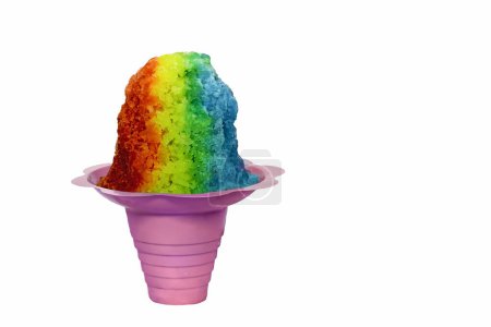 Rainbow Hawaiian Shave Ice, Shaved Ice or Snow Cone dessert in a pink flower shaped cone on a white background with copy space.