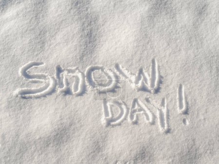 Photo for Words "Snow Day!" written in fresh fallen snow with copy space - Royalty Free Image