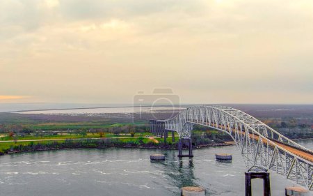 Aerial view of the Sabine Lake Causeway Bridge at Port Arthur Texas on an overcast day.