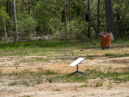 Photo for Silsbee, Texas USA - March 13, 2024: Starlink satellite receiver set out in a field in a rural area of southeastern USA for convenient internet access. - Royalty Free Image