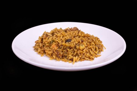 Photo for Sri Lankan biryani on a white plate against a black background - Royalty Free Image