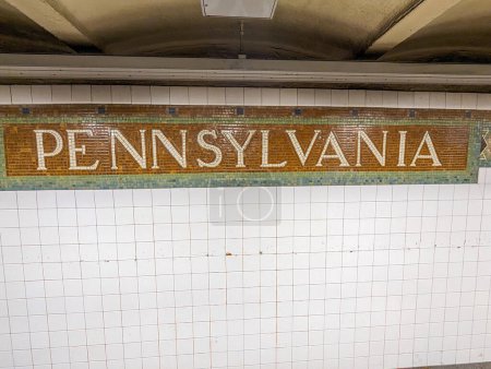 Mosaic subway sign for Penn Station in New York