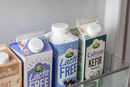 Photo for Dairy products in the refrigerator milk, yogurt and kefir without lactose. Denmark - November 23, 2023. - Royalty Free Image