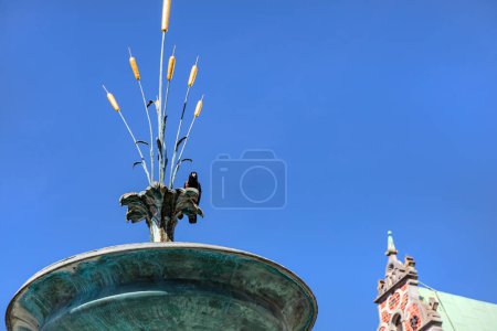 Photo for The famous Stork fountain and traditional old houses on the street in the center of Copenhagen, Denmark - Royalty Free Image