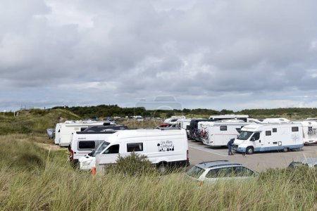Photo for Motorhomes and campingcar. Campers parked in a row in a caravan parking area. Skagen, Denmark - August 25, 2023. - Royalty Free Image