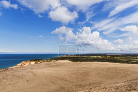 Sand dunes and seascape next to Rubjerg Knude Lighthouse, Denmark.