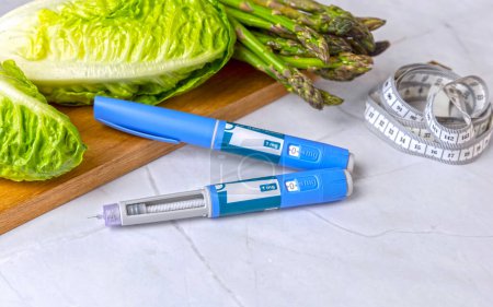 Photo for Original Danish Ozempic Insulin injection pen for diabetics and vegetables. High quality photo - Royalty Free Image