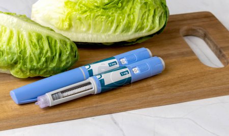 Photo for Original Danish Ozempic Insulin injection pen for diabetics and vegetables. Denmark - May 2, 2024 - Royalty Free Image