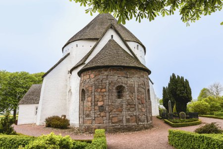 White round Osterlars church on the island of Bornholm. Concept of historical building and landmarks of Denmark. 