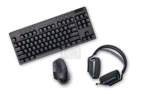 Wireless black keyboard, mouse and headphones, isolated on white background.