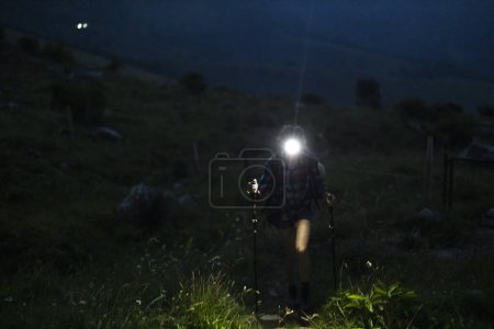 Photo for Mountain Hike With Headlight in Dark Early Morning for a Female Solo Hiker - Royalty Free Image