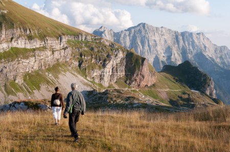 Photo for Senior Married Couple Hiking on Mangart Saddle - Julian Alps, Slovenia - Royalty Free Image