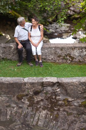 Photo for Senior Married Heterosexual Caucasian Couple having a Walk on Fresh Air of Countryside - Royalty Free Image