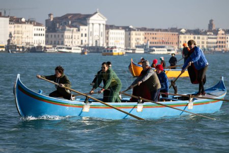 Photo for Venice, Veneto, Italy - January 28, 2024: Participants of Venice Carnival Opening Regatta on Gran Canal are Arriving at the Punta della Dogana Starting Point - Royalty Free Image