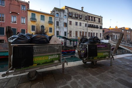 Photo for Venezia, Veneto, Italy - January 28, 2024: Waste and Garbage Disposal Service in Venice, first everything is Collected on the Sidewalk than a Ship Take it to the Disposal - Royalty Free Image