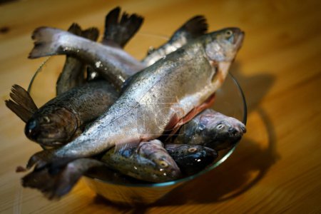 Fresh trouts in a bowl.