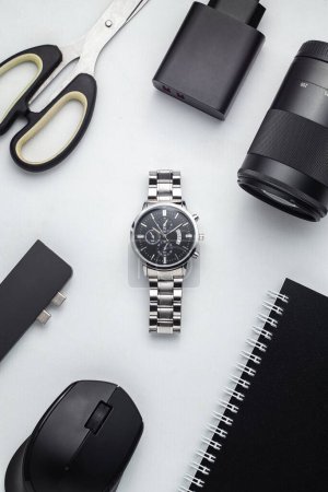 Photo for Flat lay composition with stylish wrist watch and accessories on white background. scissors, charger, camera lenses, computer mouse - Royalty Free Image