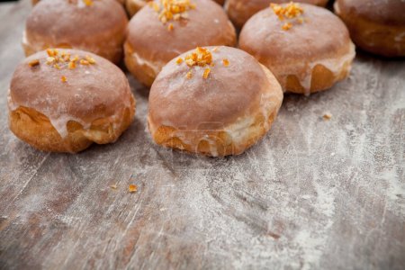 Photo for Freshly fried glazed donuts Donuts cut in half, revealing a variety of fillings such as jam, cream, or fruit preserves - Royalty Free Image