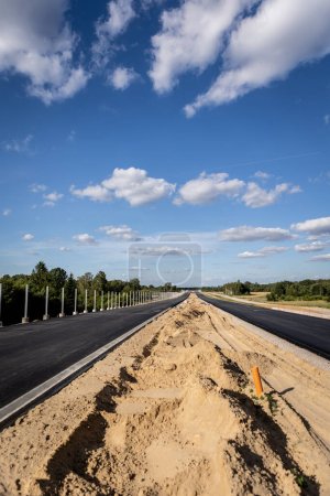 Photo for Highway construction. construction work using heavy equipment. Highways - Royalty Free Image