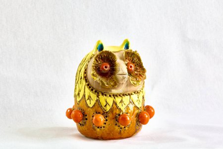multi-colored Feng Shui owl figurine made of clay