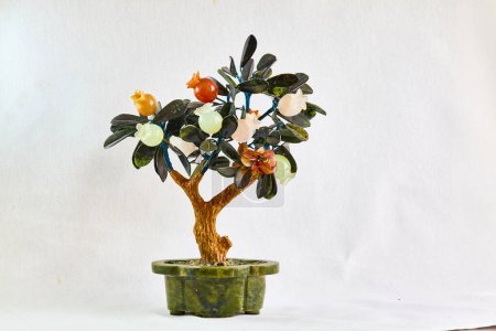 stone tree made of colored minerals in a serpintine tub