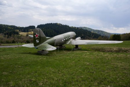 Photo for Soviet military aircraft Lisunov Li-2 on a meadow in the forest. - Royalty Free Image