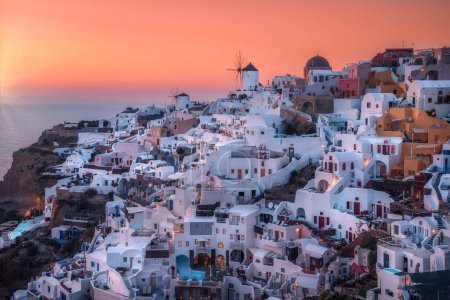 Paradise found in Santorini! This iconic image showcases the island's stunning blue domes, white houses, rugged caldera, and endless sea.
